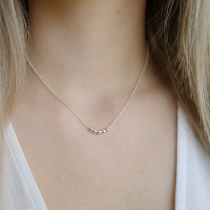 Silver Symbolic Beaded Necklace