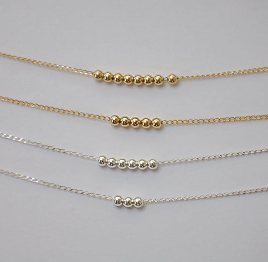 Gold Symbolic Beaded Necklace
